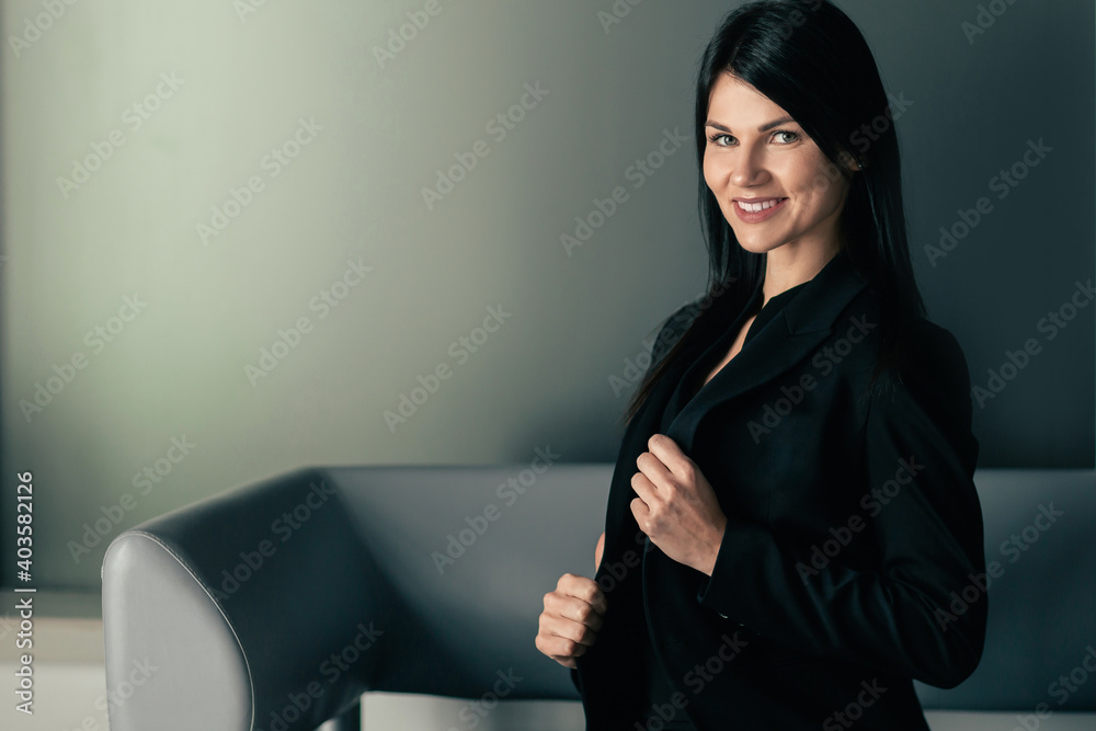 smiling business woman sitting in office lobby. smiling business woman sitting in office lobby.