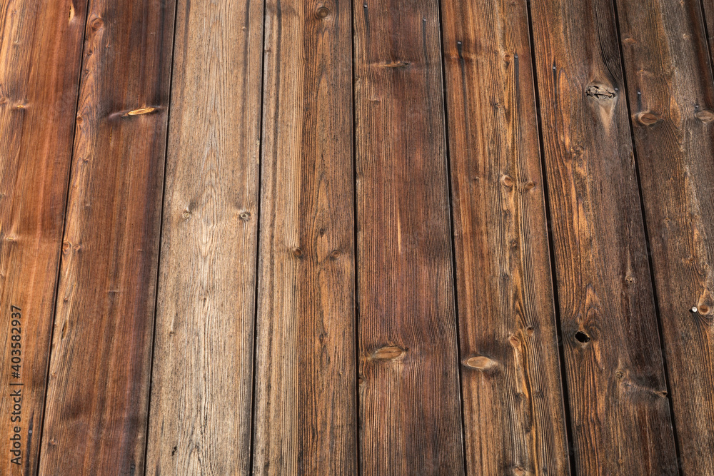 Fototapeta premium Background: old weathered wood texture with figure and knotholes, brown