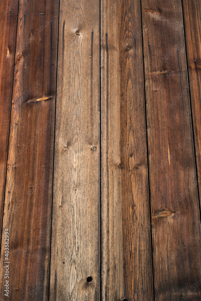Background: old weathered wood texture with figure and knotholes, brown Background: old weathered wood texture with figure and knotholes, brown