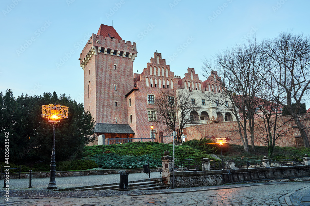 red brick tower reconstructed royal castle  in the evening