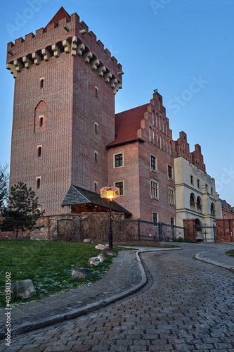 red brick tower reconstructed royal castle in the evening