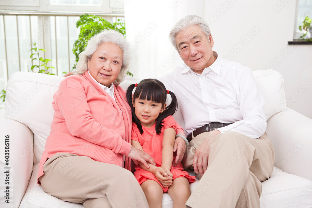 Happy grandparents and grandchildren are playing in the living room Happy grandparents and grandchildren are playing in the living room