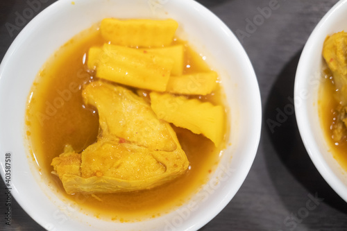 Sea bass in yellow curry with fresh papaya.