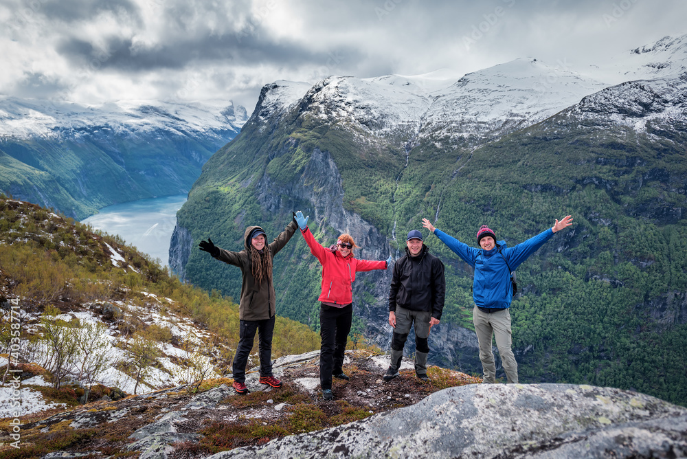 Four happy frieng over fjord