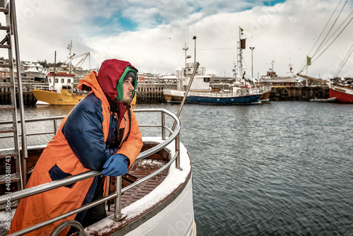 Fotografia, Obraz fisherman in winter scandinavian port