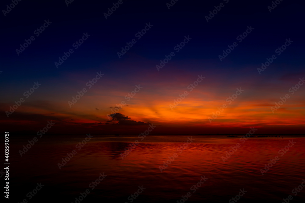 Twilight sky and soft star with motion water surface at the lake in golden time.