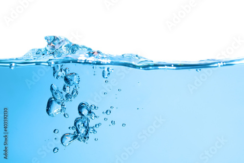 Pouring made a splash of blue waves under the water and Bubbles flowing up on water surface in nature. with copy space