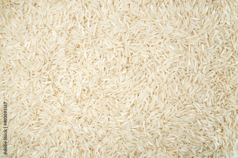 White long basmati rice textured background. Gluten free food. White long basmati rice textured background. Gluten free food.
