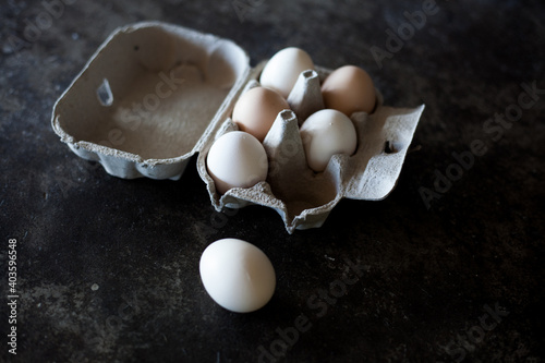 Eggs in a tray on grey