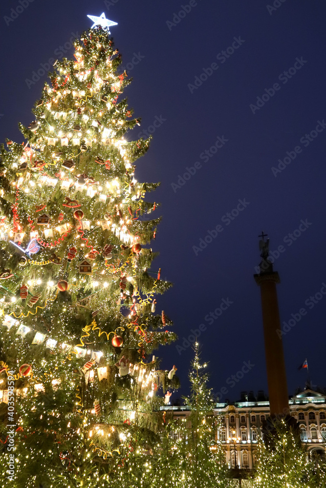 beautiful tall christmas tree with lights and toys on Palace square in Saint Petersburg, Russia