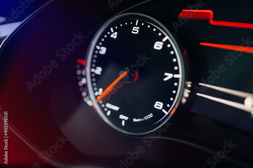 Modern car close up view of tachometer and dashboard with backlight