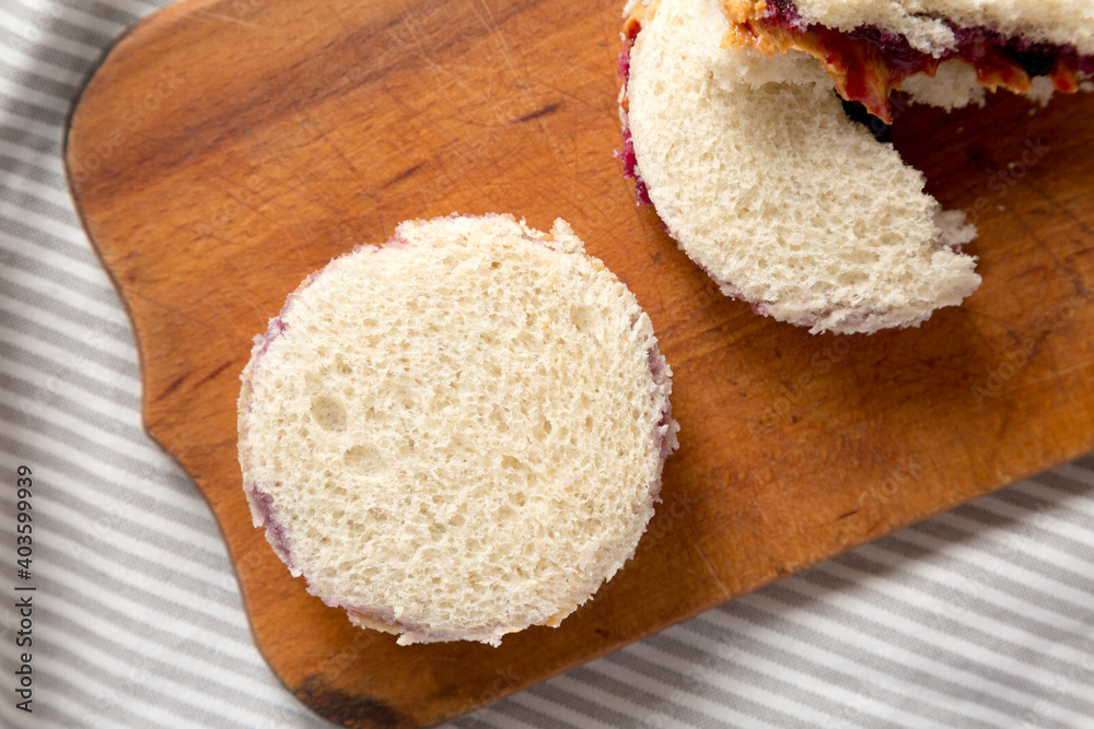 Homemade Crustless Peanut Butter and Jelly Circles on a rustic wooden board, top view. Close-up. Homemade Crustless Peanut Butter and Jelly Circles on a rustic wooden board, top view. Close-up.