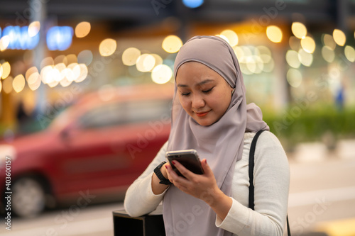 Young teenager waiting vehicle at stop station.