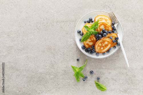 Fritters, pancakes with fresh blueberry