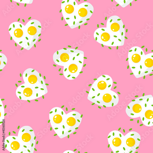 Seamless pattern with fried eggs and greens in the shape of a heart, breakfast for Valentine's Day.