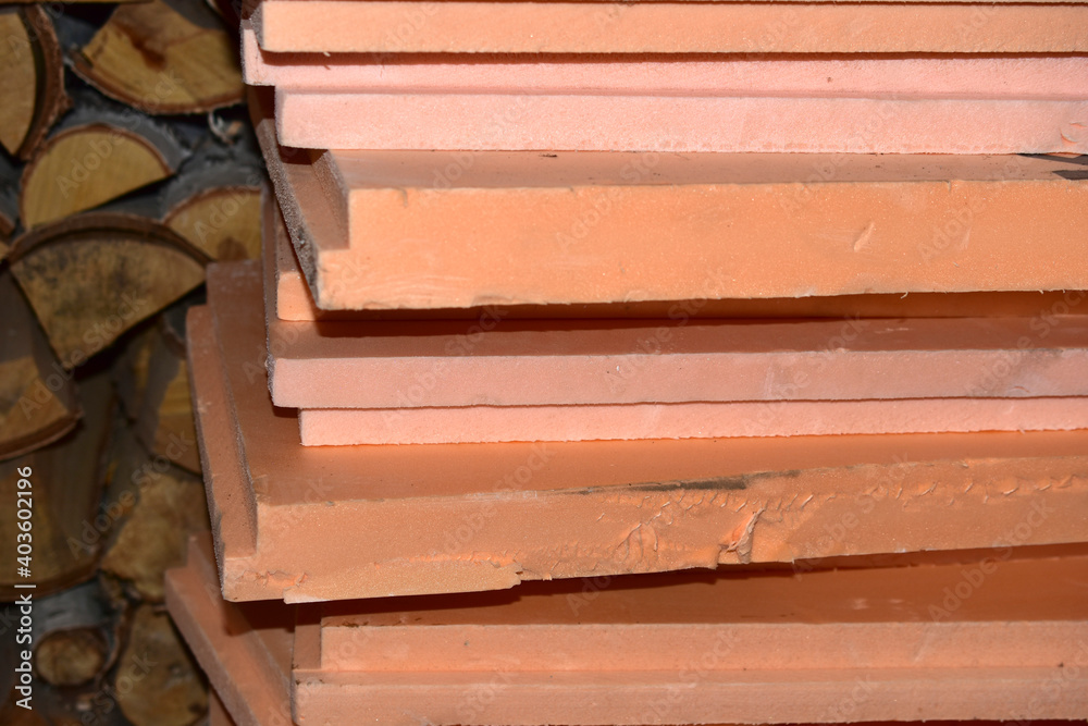 Insulation panels made of styrofoam stacked in the garage Insulation panels made of styrofoam stacked in the garage