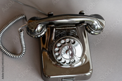 An old black telephone from the 50s with dial