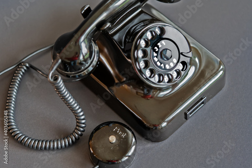 An old black telephone from the 50s with dial