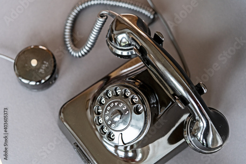 An old black telephone from the 50s with dial