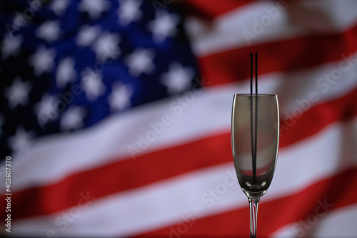 Happy 4th of July, independence day USA. Sparkler on american flag background