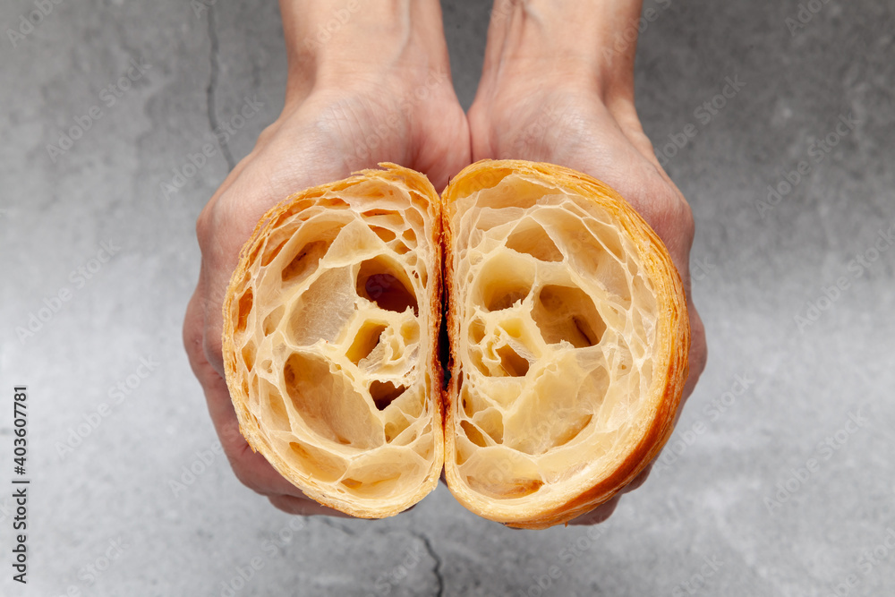 Fresh baked croissants on cement background.