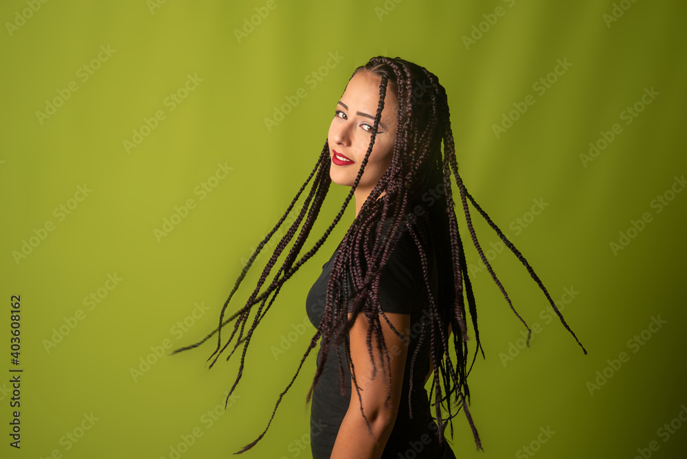 Beautiful girl with pigtails in her hair, colorful background, selective focus.