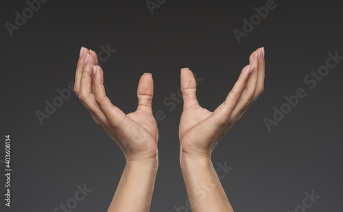 Woman's hands offering support