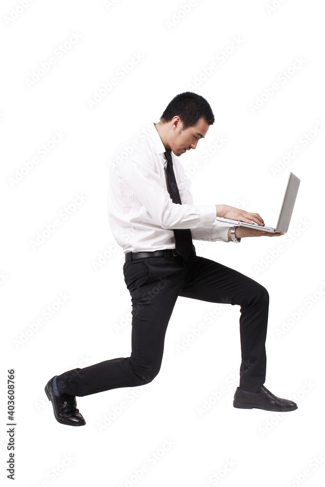 A young business man Holding Laptop Computer A young business man Holding Laptop Computer