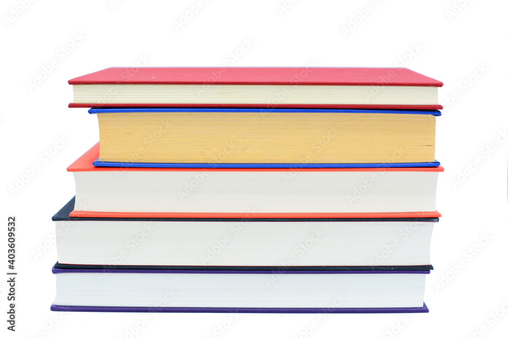 Isolated books, stacked over one another in front of a white background Isolated books, stacked over one another in front of a white background