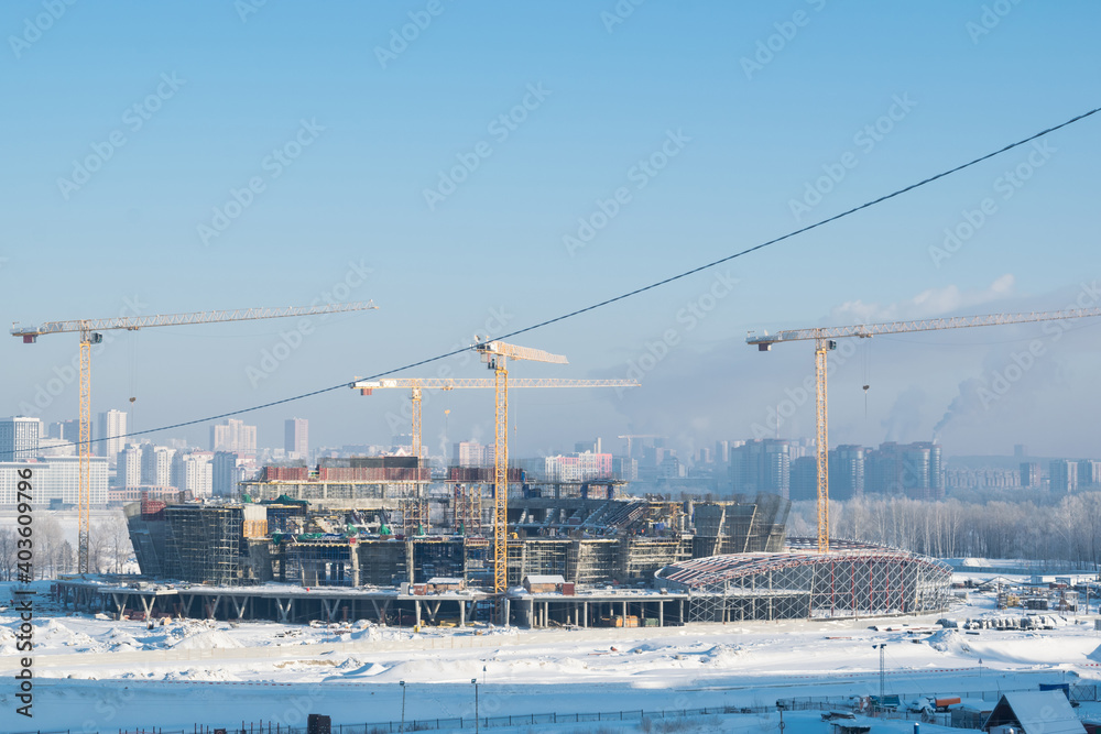 Fototapeta premium Stadium under construction covered with snow in the cold
