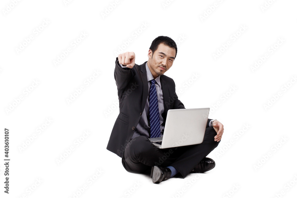 A happy young Business man using laptop A happy young Business man using laptop