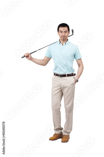 Young man wearing a suit and golfing