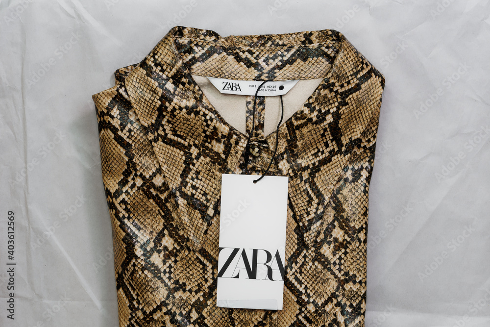 Zara Spanish clothes brand online delivery. Order package containing  Inditex retailer animal print female folded shirt with company logo. Stock  Photo | Adobe Stock