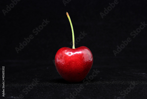 Fresh cherry on a black background