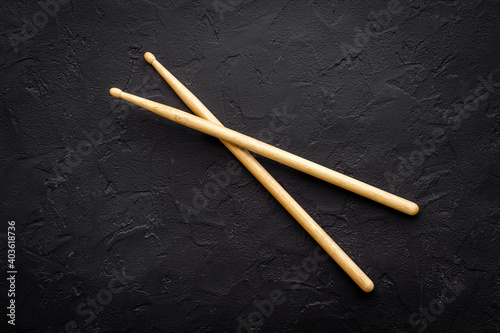 Two wooden drum sticks, top view. Music background
