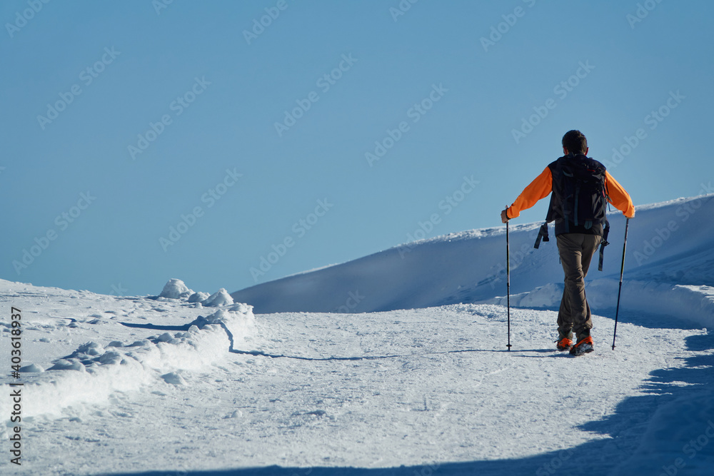 man walking on snow