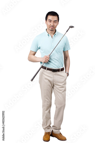 Young man wearing a suit and golfing