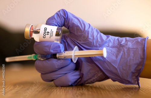 Coronavirus, Covid 19 virus, vaccine vial. Vaccine phial with transparent fluid for coronavirus covid-19.	
 photo