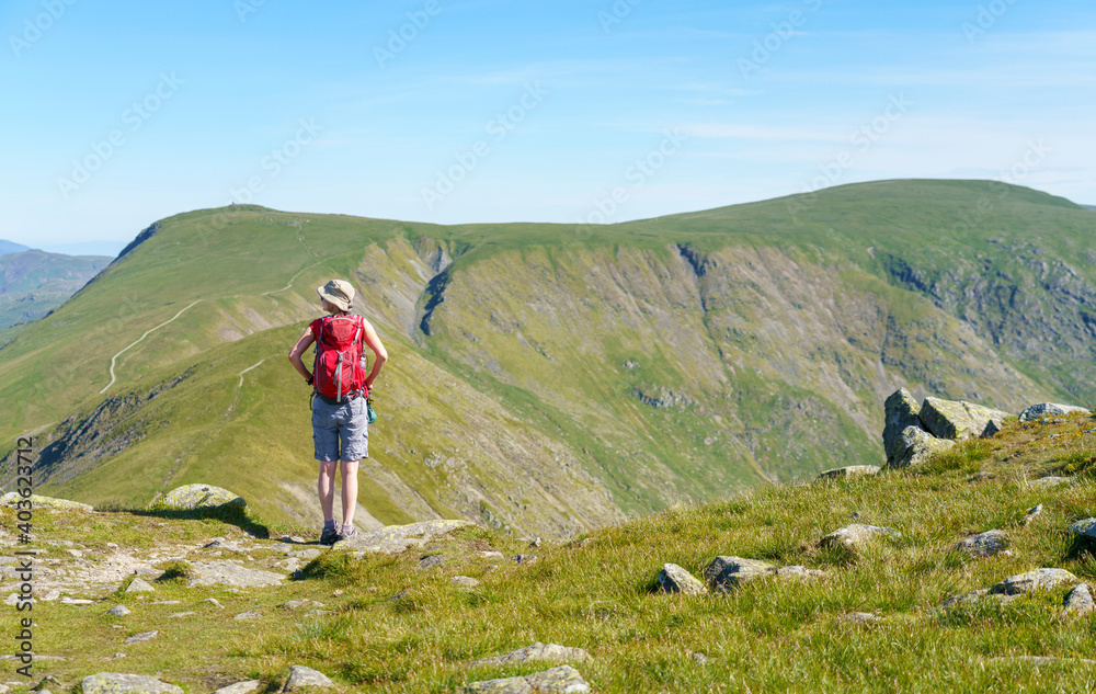 A female hiker taking in the views of Froswick and Thornthwaite