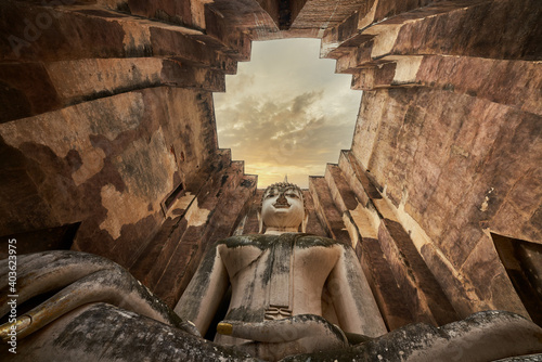 Giant buddha sculpture in stupa at wat sri chum sukhothai