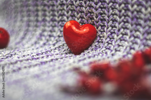 Valentine s day red heart background  macro composition  knitted sweater and decoration  blurred