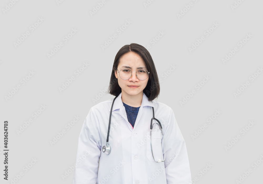 Portrait female doctor standing on white background in uniform wear glasses and stethoscope, copy space. medical-care concept Portrait female doctor standing on white background in uniform wear glasses and stethoscope, copy space. medical-care concept