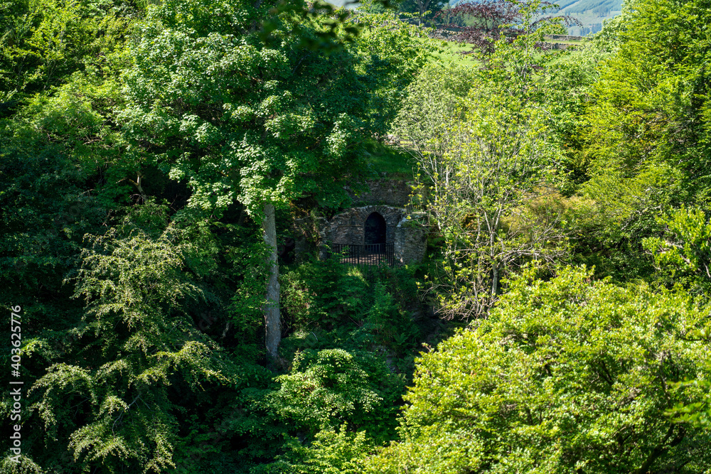 A viewing platform amongst the trees that provides a viewpoint for the Falls of Acharn on the Rob Roy Way and near Loch Tay in the Scottish Highlands, UK.