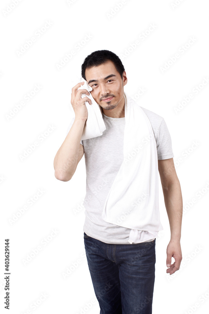 A happy young man wiping with towel A happy young man wiping with towel