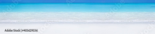 Tropical beach scene of azure crystal sea with soft waves. Long banner © photopixel