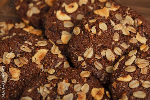 delicious homemade healthy cookies. oatmeal and nut cookies. on wooden background. 