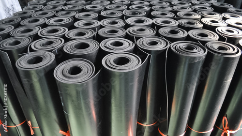 warehouse rolls of rubber. black rolls. photo