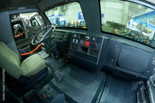Fototapeta Naklejka Na Ścianę i Meble -  Interior of an armored personnel carrier, steering wheel dashboard seats
