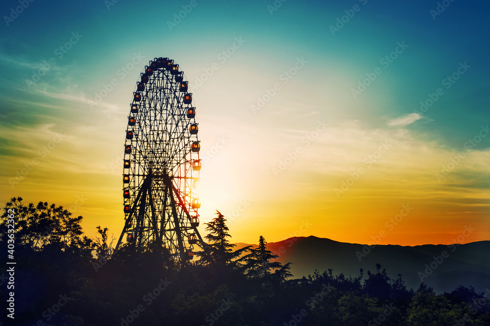 Observation wheel sunset beautiful cloudy sky