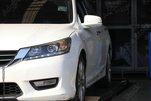 white car in garage for checking © sittinan